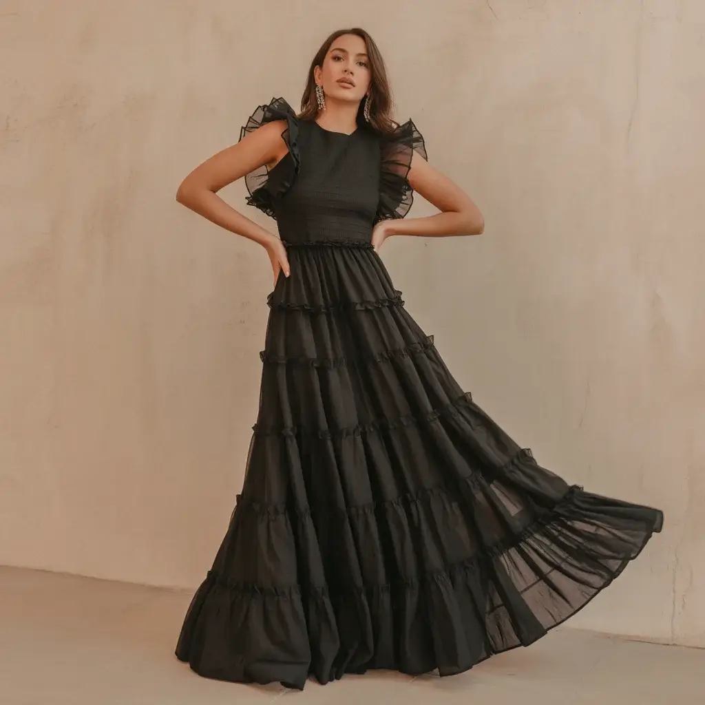 13 Black Long Dresses for Wedding Guests 10 Black tiered ruffle maxi dress with cascading layers and romantic movement