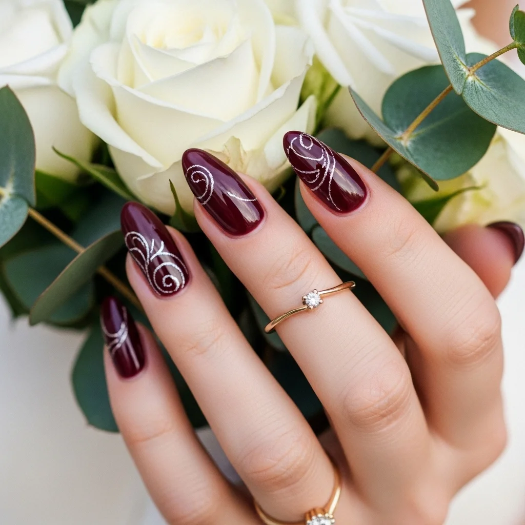 maroon almond shape with delicate swirls